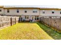 Fenced yard with a patio perfect for outdoor dining at 2325 Thackery Rd, Snellville, GA 30078