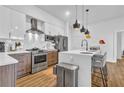 Modern kitchen with stainless steel appliances, white cabinetry, and a stylish backsplash at 112 Rogers Ne St # 207, Atlanta, GA 30317