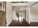 Elegant foyer with dark hardwood floors, staircase with iron railing, and neutral paint at 209 Brynn Ln, Mcdonough, GA 30252