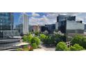 Beautiful city view with green trees, street and modern high-rise buildings at 3324 Peachtree Ne Rd # 905, Atlanta, GA 30326
