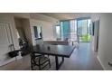 Cozy living space with modern furnishings and city views through large windows at 3324 Peachtree Ne Rd # 905, Atlanta, GA 30326