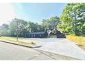 The charming exterior of the home features a spacious yard and ample parking at 380 Amal Sw Dr, Atlanta, GA 30315