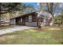 Stylish single-story home featuring a beautifully landscaped yard and a contemporary color scheme at 2760 Swansea Ct, College Park, GA 30349