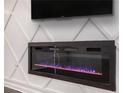 Close-up of the modern fireplace with decorative trim and black frame at 2760 Swansea Ct, College Park, GA 30349