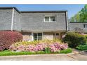 Exterior of a charming townhouse adorned with blooming azaleas and lush greenery at 1152 Hampton Ne Way, Atlanta, GA 30324