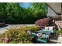 Cozy patio area with comfortable seating nestled amidst vibrant azalea bushes at 1152 Hampton Ne Way, Atlanta, GA 30324