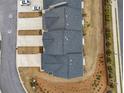 Aerial view of townhomes showing roof lines, driveways, and street access at 1307 Park Center Cir, Austell, GA 30168