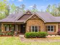 Beautiful stone accents highlight the covered front porch and entry way at 575 W Wayside Rd, Carrollton, GA 30116