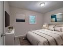 Comfortable bedroom with neutral tones, artwork, and plenty of natural light at 3647 Miller St, Lithia Springs, GA 30122