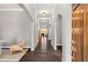 Bright hallway with hardwood floors, archways, and elegant lighting at 403 Aristides Way, Canton, GA 30115