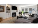 Bright living room with hardwood floors, fireplace, and comfortable seating arrangement at 907 Edgewood Ave, Atlanta, GA 30307