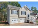 Charming two-story home features a two car garage, black shutters, and a welcoming front entrance at 176 Villa Rosa Rd, Temple, GA 30179