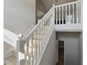 Bright interior shot of the house featuring a staircase with white railings and natural light at 176 Villa Rosa Rd, Temple, GA 30179