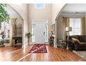 Bright and welcoming entryway with high ceilings, hardwood floors, and elegant decor at 1070 Cureton Dr, Austell, GA 30106