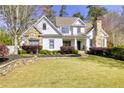 Well-maintained home with a stone and siding exterior, landscaped yard, and charming curb appeal at 1226 Goodwin Ne Rd, Atlanta, GA 30324