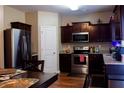 Spacious kitchen with stainless steel appliances, granite countertops, and wood cabinets at 20 Autumn Canyon Se Path, Cartersville, GA 30121