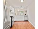 Functional kitchen with stainless steel appliances and hardwood floors, perfect for cooking at 4420 Thorngate Ln, Acworth, GA 30101