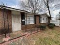 Exterior shot of a brick home showcasing the front door and security features at 1895 Thomasville Se Dr, Atlanta, GA 30315
