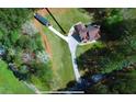 Aerial view of a home with long driveway, surrounded by lush greenery at 3405 River Ridge, Stockbridge, GA 30281