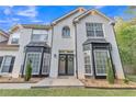 Close up of a two story white brick home with double door entryway at 3405 River Ridge, Stockbridge, GA 30281