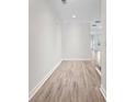 Bright hallway with laminate flooring leading to other areas of the home at 2251 W Village Se Ln, Smyrna, GA 30080