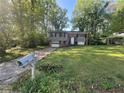 Exterior of home with front yard, driveway, and lush greenery at 561 Santa Barbara Dr, Forest Park, GA 30297