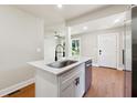 Bright kitchen with stainless steel appliances, hardwood floors, and a center island at 2081 Verbena Nw St, Atlanta, GA 30314