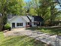 Inviting single-Gathering home featuring a well-manicured lawn and a long driveway, perfect for multiple vehicles at 3013 Barcelona Way, Conyers, GA 30012
