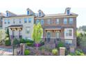 Charming brick townhome with manicured front yard and black iron fence at 4007 Dunwoody Trce, Atlanta, GA 30338