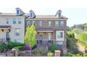 Charming townhome with brick facade, dormer windows, and inviting entrances in a desirable neighborhood at 4007 Dunwoody Trce, Atlanta, GA 30338