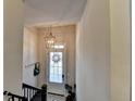 Foyer with natural light, decorative light fixture, and tiled floor at 4007 Dunwoody Trce, Atlanta, GA 30338