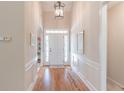 Elegant foyer showcasing hardwood floors, high ceilings, and decorative trim at 3853 Coralberry Ct, Dacula, GA 30019
