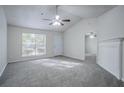 Bright living room featuring vaulted ceilings, new carpet, fireplace, and an open layout at 2800 Macon Se Dr, Atlanta, GA 30354