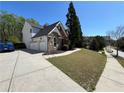 A two-story home featuring a three-car garage and spacious driveway at 2964 Olivine Dr, Dacula, GA 30019