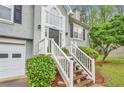 Inviting front entrance with decorative door and manicured shrubbery at 4917 Baker Ridge Pl, Acworth, GA 30101