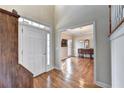 Elegant foyer with hardwood floors and open view into the dining room at 8100 Greens Mill Way, Loganville, GA 30052
