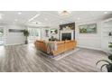 Spacious living room with coffered ceilings, modern fireplace, built-ins, and ample natural light at 750 Southland Pass, Stone Mountain, GA 30087