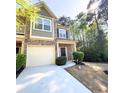 Two-story townhome boasting a well-maintained lawn and inviting curb appeal at 2333 Castle Keep Way, Atlanta, GA 30316