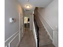 Inviting hallway with staircase and neutral color palette, leading to a well-lit area at 2333 Castle Keep Way, Atlanta, GA 30316