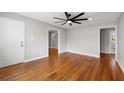 Bright living room featuring hardwood floors, neutral paint, and a modern ceiling fan at 2461 Antwerp Se Dr, Atlanta, GA 30315