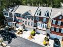 Aerial view of brick townhomes with two-car garages at 2928 Wintercrest Way, Atlanta, GA 30360