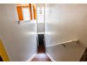 View of entryway with hardwood stairs, gray walls, and a black front door at 2928 Wintercrest Way, Atlanta, GA 30360