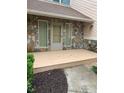 Home's front porch has stone accents, neutral paint, and a cozy outdoor space at 4487 Park Place Ter, Marietta, GA 30066