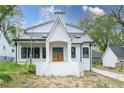 Stylish two-story home with a black metal roof and an inviting entrance at 3353 Hemphill St, Atlanta, GA 30337