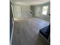 Spacious living room featuring modern flooring and neutral paint at 912 Holden Ln, Atlanta, GA 30349