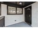 Inviting front porch with decorative black door and a view into the bright, freshly painted interior at 2241 Glendale Dr, Decatur, GA 30032