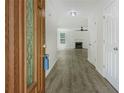 Bright entryway featuring wood-look flooring, white walls, and a view into the living room at 3131 Leyland Ct, Decatur, GA 30034