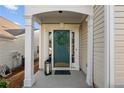 Inviting front porch with decorative wreath and lantern, creating a warm and welcoming entrance at 3915 Deerborne Dr, Cumming, GA 30040