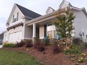 A charming single-story home with a welcoming front porch and well-maintained landscaping adding to its curb appeal at 15 Masters Dr, Villa Rica, GA 30180
