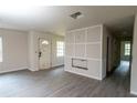 Unfinished living room featuring new gray floors, white walls, and a front door at 2191 Camp Ground Rd, Atlanta, GA 30331